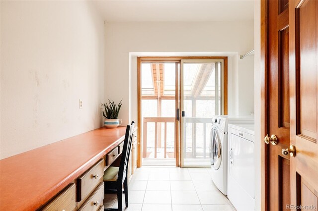 laundry room with washer and clothes dryer, light tile patterned floors, and a wealth of natural light