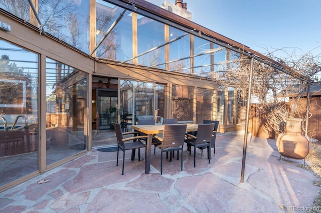 view of patio featuring outdoor dining area