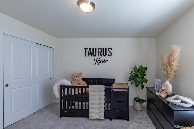 carpeted bedroom featuring a crib