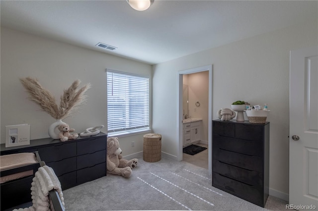 8240 S White Crow St, Aurora, CO 80016 - bedroom with light carpet, ensuite bath, and baseboards
