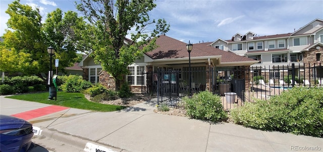 12711 Colorado Blvd Unit 1116, Thornton, CO 80241 - view of front of home with a shingled roof