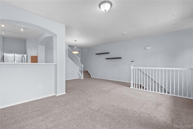 12711 Colorado Blvd Unit 1116, Thornton, CO 80241 - carpeted spare room with rail lighting and arched walkways
