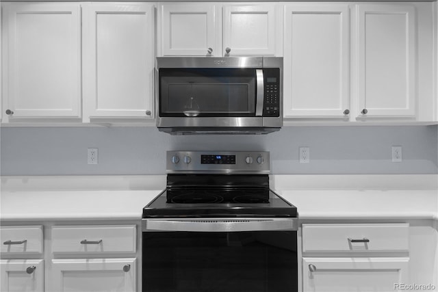 12711 Colorado Blvd Unit 1116, Thornton, CO 80241 - kitchen featuring stainless steel appliances, white cabinetry, and light countertops