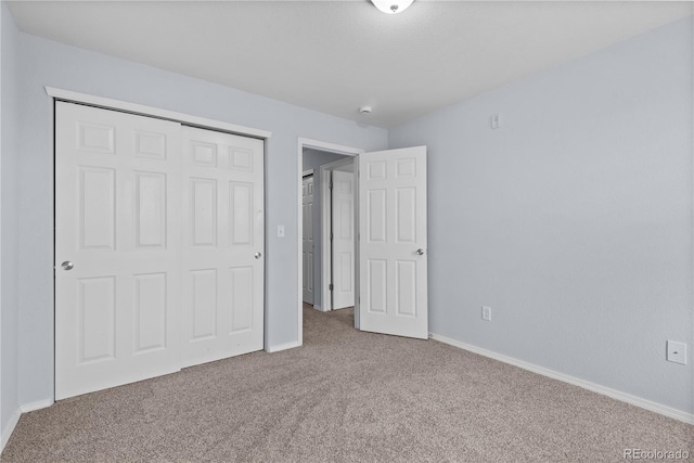 12711 Colorado Blvd Unit 1116, Thornton, CO 80241 - unfurnished bedroom featuring carpet, baseboards, and a closet