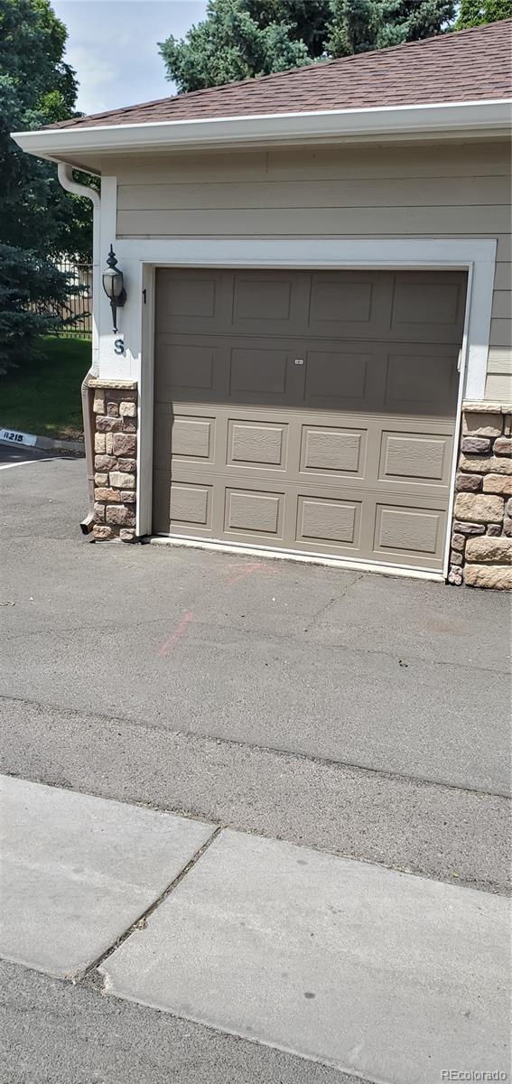 12711 Colorado Blvd Unit 1116, Thornton, CO 80241 - garage featuring driveway