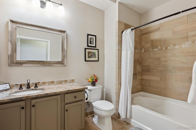 full bathroom featuring vanity, shower / bath combo, and toilet