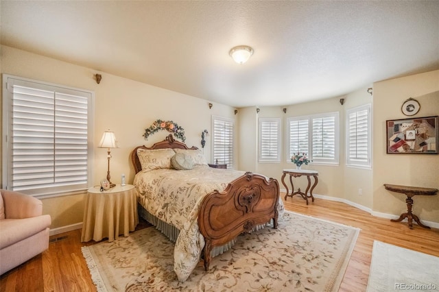 bedroom featuring hardwood / wood-style floors