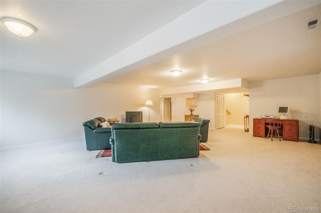 carpeted living room featuring beam ceiling