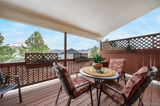 wooden terrace featuring a mountain view