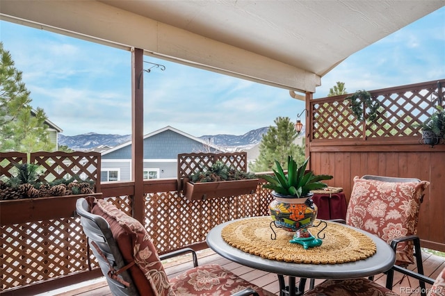 wooden terrace with a mountain view