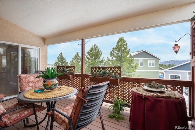 wooden deck featuring a mountain view