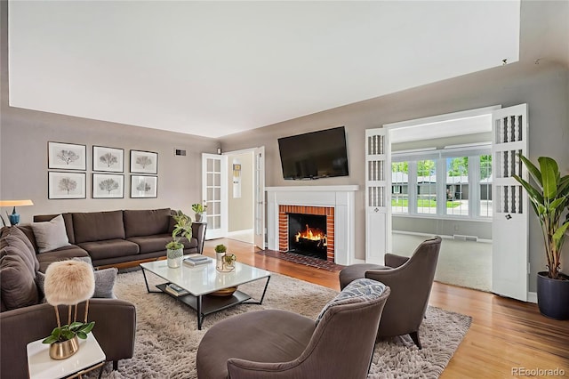 8525 Grandview Ave, Arvada, CO 80002 - living room with wood finished floors and a fireplace