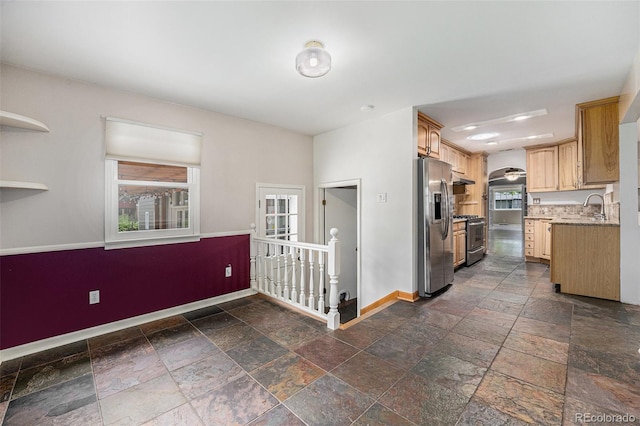 8525 Grandview Ave, Arvada, CO 80002 - kitchen featuring appliances with stainless steel finishes, stone tile flooring, custom exhaust hood, recessed lighting, and under cabinet range hood