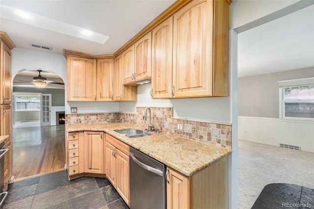 8525 Grandview Ave, Arvada, CO 80002 - kitchen featuring stainless steel dishwasher, light brown cabinets, a ceiling fan, light stone counters, and a wainscoted wall