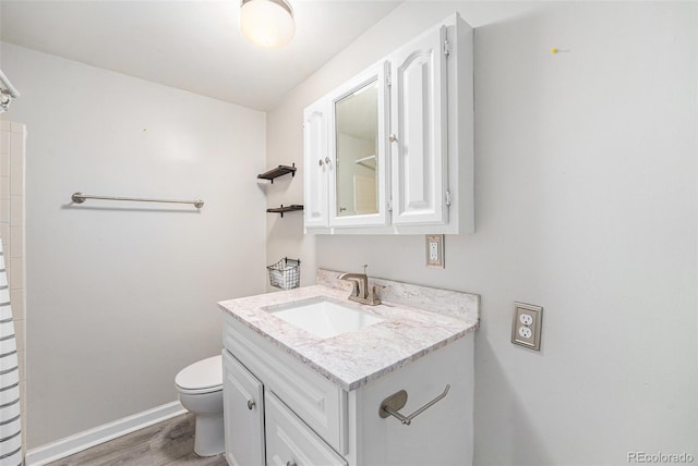 8525 Grandview Ave, Arvada, CO 80002 - bathroom with vanity and wood finished floors