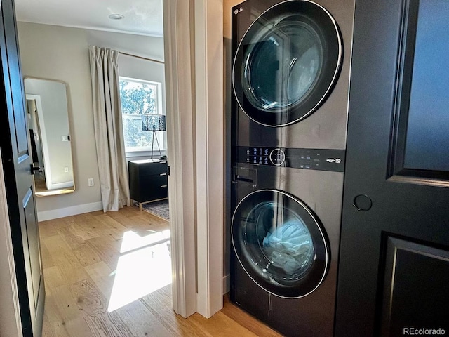 518 Conifer Dr, Bailey, CO 80421 - laundry room with estacked washer and dryer and wood finished floors