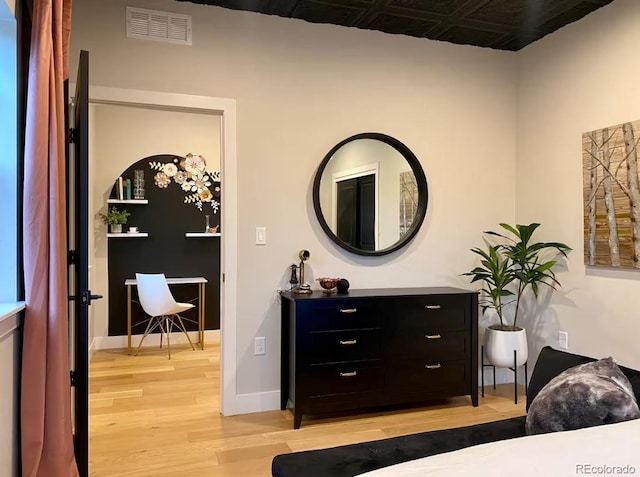 518 Conifer Dr, Bailey, CO 80421 - bedroom with light wood-style floors and an ornate ceiling