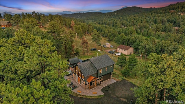 518 Conifer Dr, Bailey, CO 80421 - aerial view of property and surrounding area with a mountain backdrop
