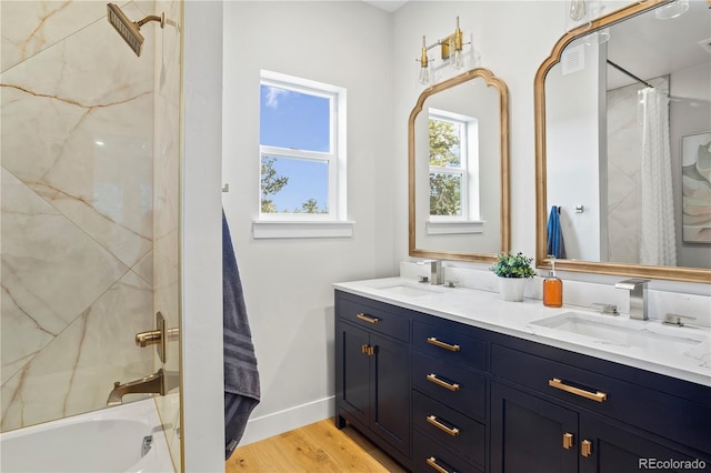 518 Conifer Dr, Bailey, CO 80421 - bathroom with double vanity, shower / tub combo, and wood finished floors