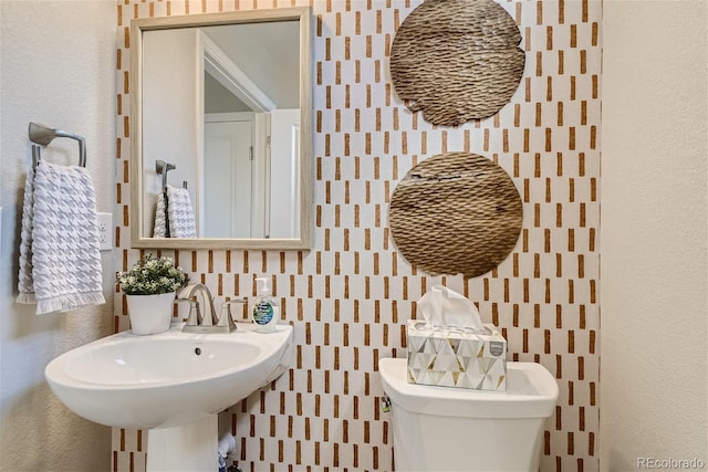 bathroom with toilet and sink