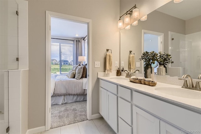 bathroom featuring tile patterned floors, vanity, and an enclosed shower