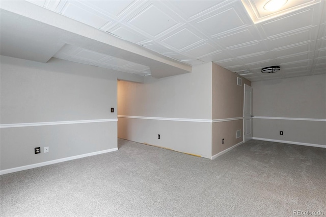 finished below grade area featuring carpet flooring and baseboards