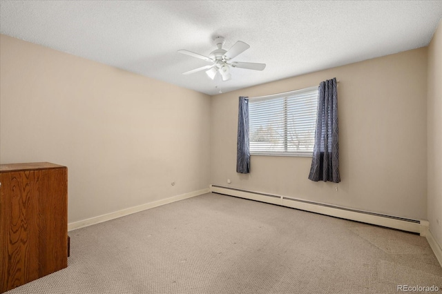 720 S Clinton St Unit 1B, Denver, CO 80247 - carpeted spare room with baseboard heating, ceiling fan, baseboards, and a textured ceiling