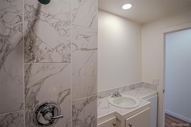 327 E 7th St, Walsenburg, CO 81089 - full bathroom featuring a tile shower, vanity, wood finished floors, and recessed lighting