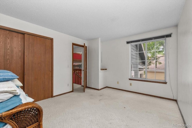13341 Birch Cir, Thornton, CO 80241 - unfurnished bedroom with light colored carpet, a textured ceiling, and a closet