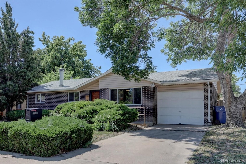 single story home featuring a garage