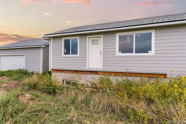 view of front of property with a garage