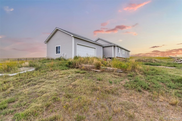 view of side of home with a garage