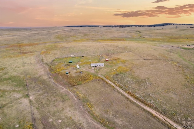 birds eye view of property featuring a rural view