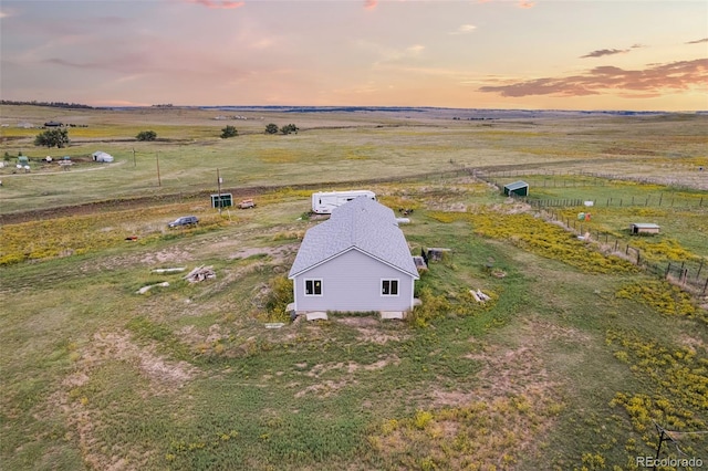 birds eye view of property featuring a rural view