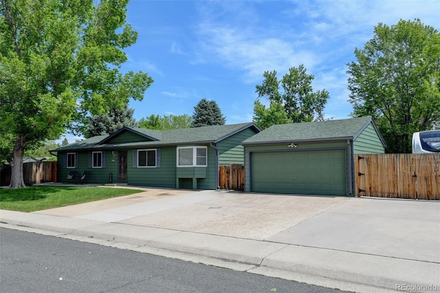 5986 Dunraven St, Golden, CO 80403 - single story home with a garage, concrete driveway, and a shingled roof