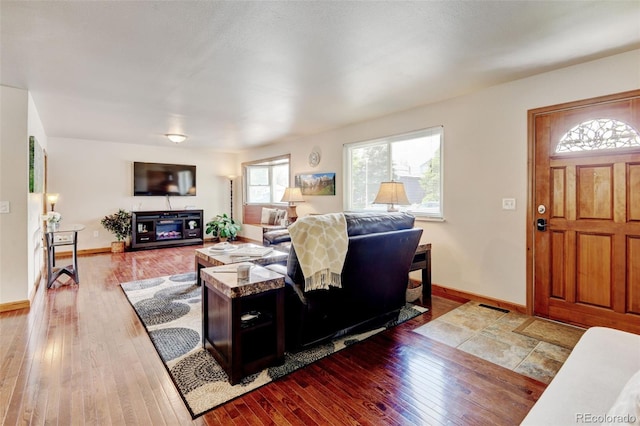 5986 Dunraven St, Golden, CO 80403 - living area featuring wood-type flooring and baseboards