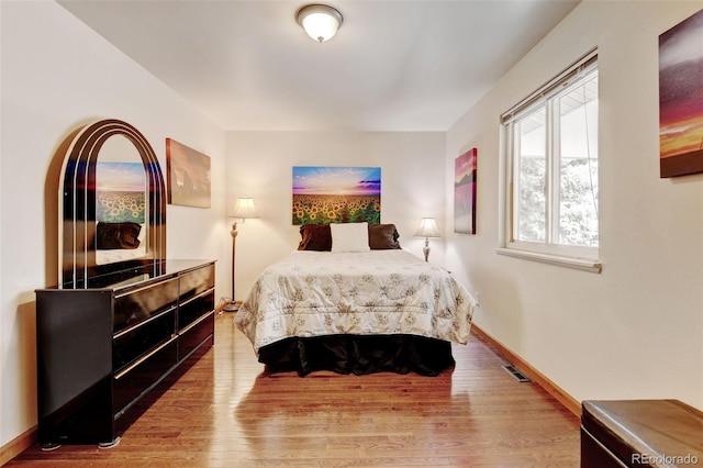 5986 Dunraven St, Golden, CO 80403 - bedroom featuring wood finished floors and baseboards