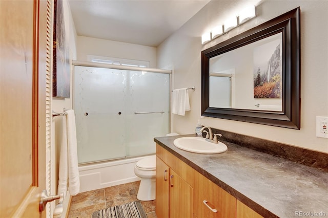 5986 Dunraven St, Golden, CO 80403 - full bathroom with vanity, toilet, and enclosed tub / shower combo