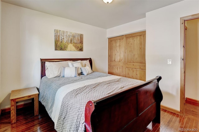 5986 Dunraven St, Golden, CO 80403 - bedroom with wood-type flooring, baseboards, and a closet
