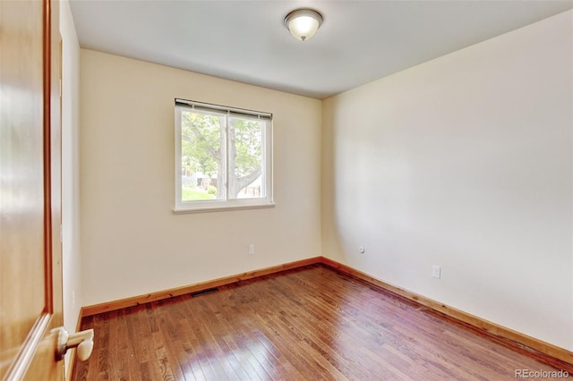 5986 Dunraven St, Golden, CO 80403 - unfurnished room featuring wood-type flooring and baseboards