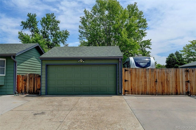 5986 Dunraven St, Golden, CO 80403 - garage featuring a gate and driveway