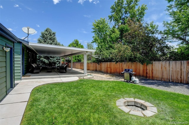 5986 Dunraven St, Golden, CO 80403 - view of yard featuring an outdoor living space with a fire pit and a patio area