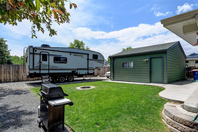 5986 Dunraven St, Golden, CO 80403 - view of yard with an outdoor fire pit and an outbuilding