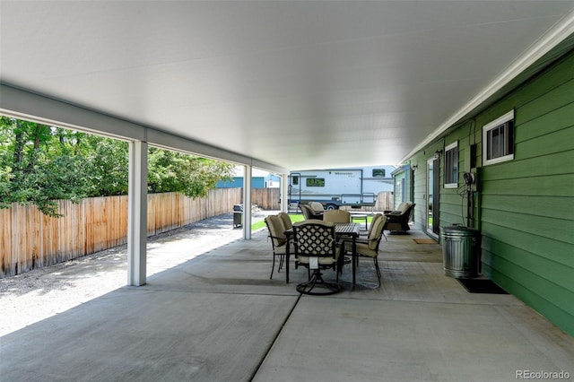 5986 Dunraven St, Golden, CO 80403 - fenced backyard featuring outdoor dining space and a patio area