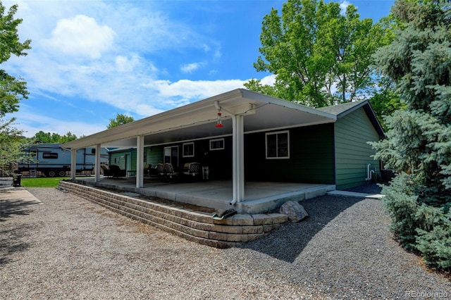 5986 Dunraven St, Golden, CO 80403 - view of property exterior with a patio area