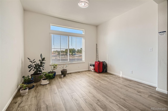 4403 Picadilly Ct, Aurora, CO 80019 - empty room with wood finished floors and baseboards