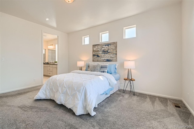4403 Picadilly Ct, Aurora, CO 80019 - carpeted bedroom with baseboards and ensuite bath