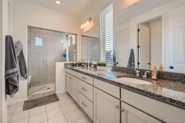 4403 Picadilly Ct, Aurora, CO 80019 - bathroom with double vanity, a shower stall, and tile patterned floors
