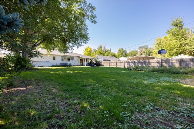 view of yard featuring fence