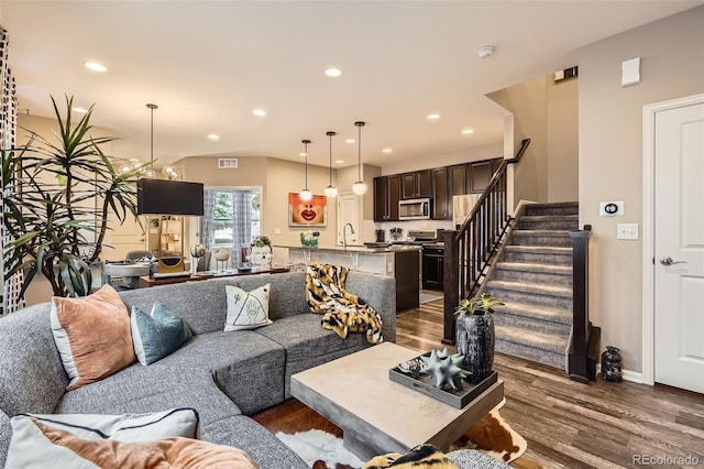 1519 S Dayton St, Denver, CO 80247 - living area with wood finished floors, stairs, and recessed lighting